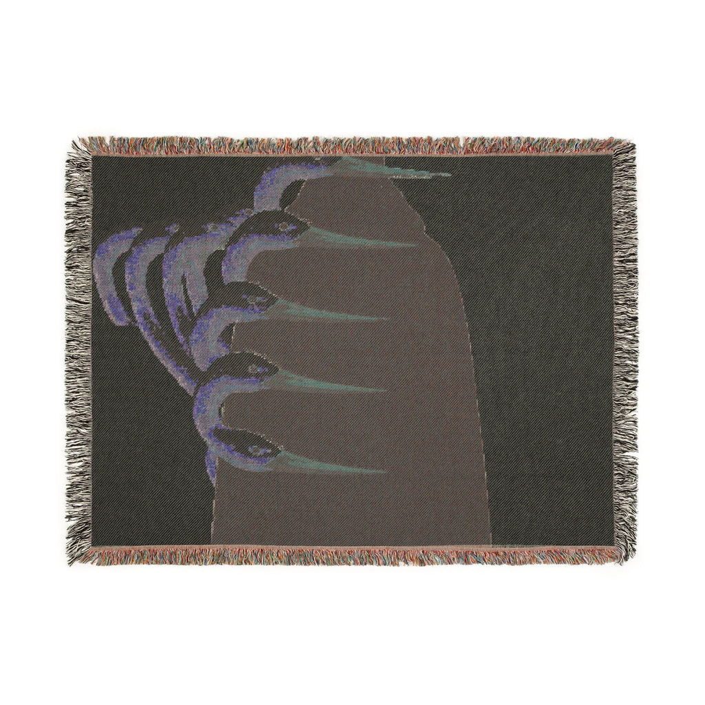 PURETE woven cotton throw blanket featuring a dark abstract graphic with colorful fringed edges.