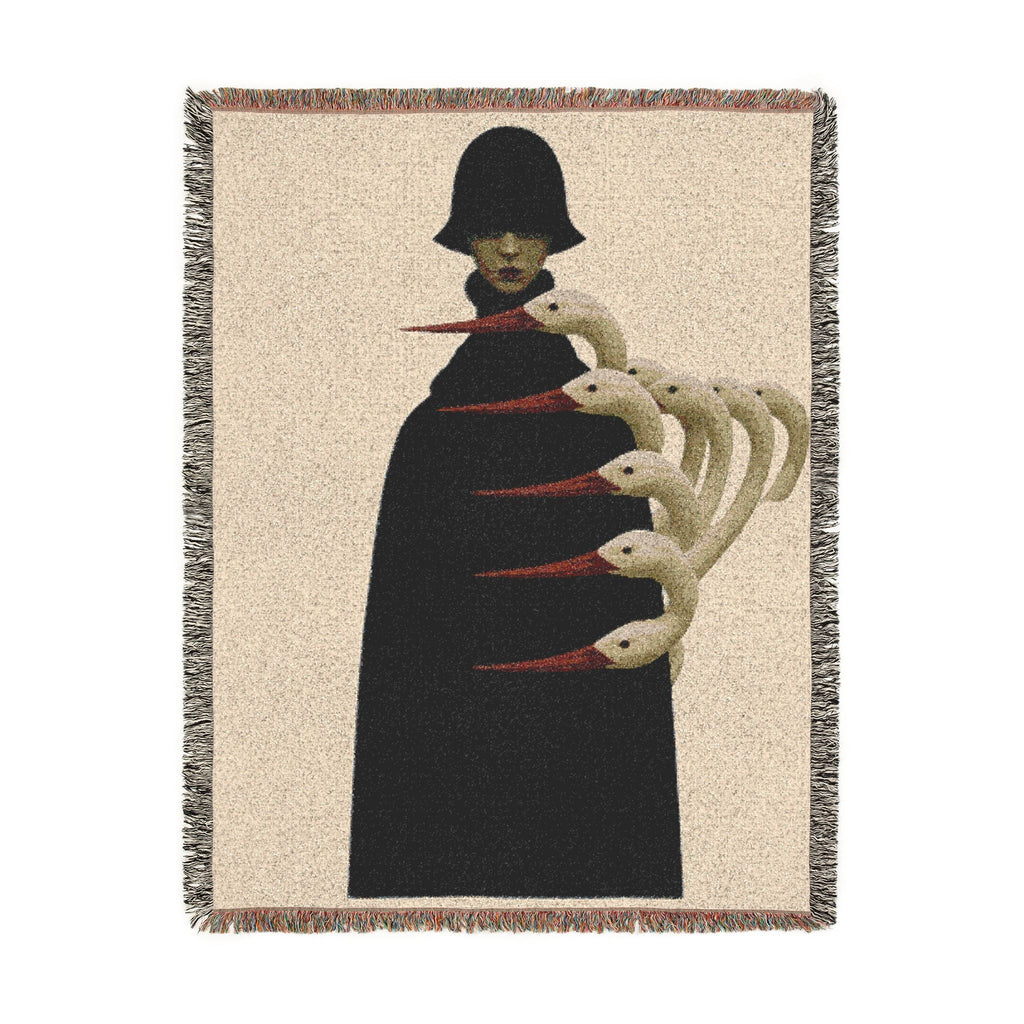 PURETE woven cotton throw blanket featuring a surreal illustration of a figure in a black coat with swan necks.