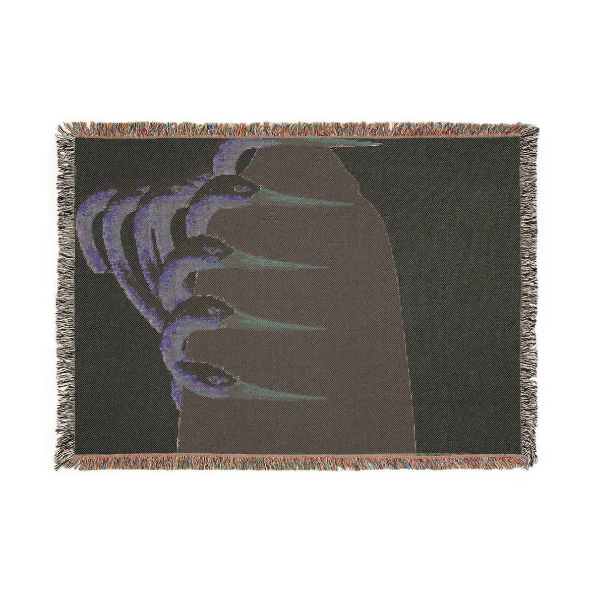 PURETE woven cotton throw blanket featuring a dark abstract graphic with claw-like shapes and colorful fringed edges.
