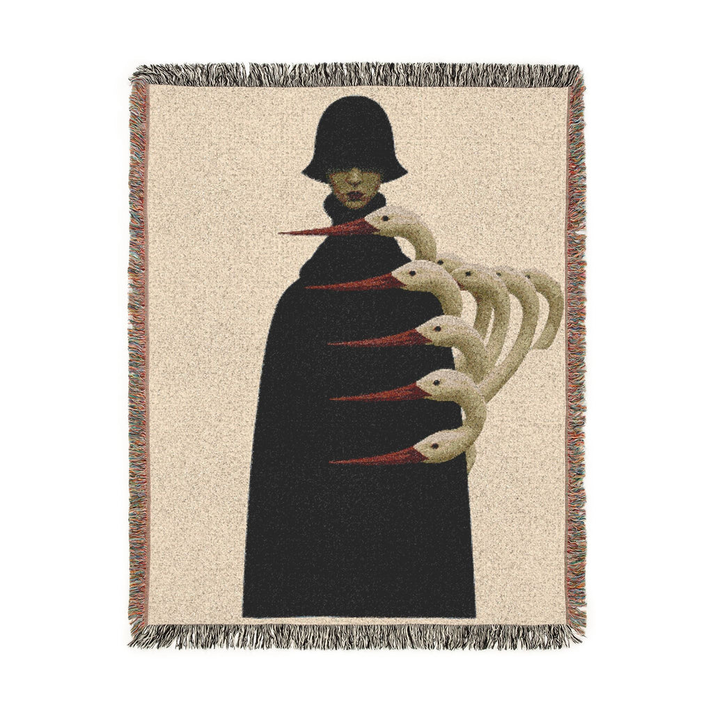 PURETE woven cotton throw blanket featuring a surreal illustration of a figure in a black coat with swan-like necks.