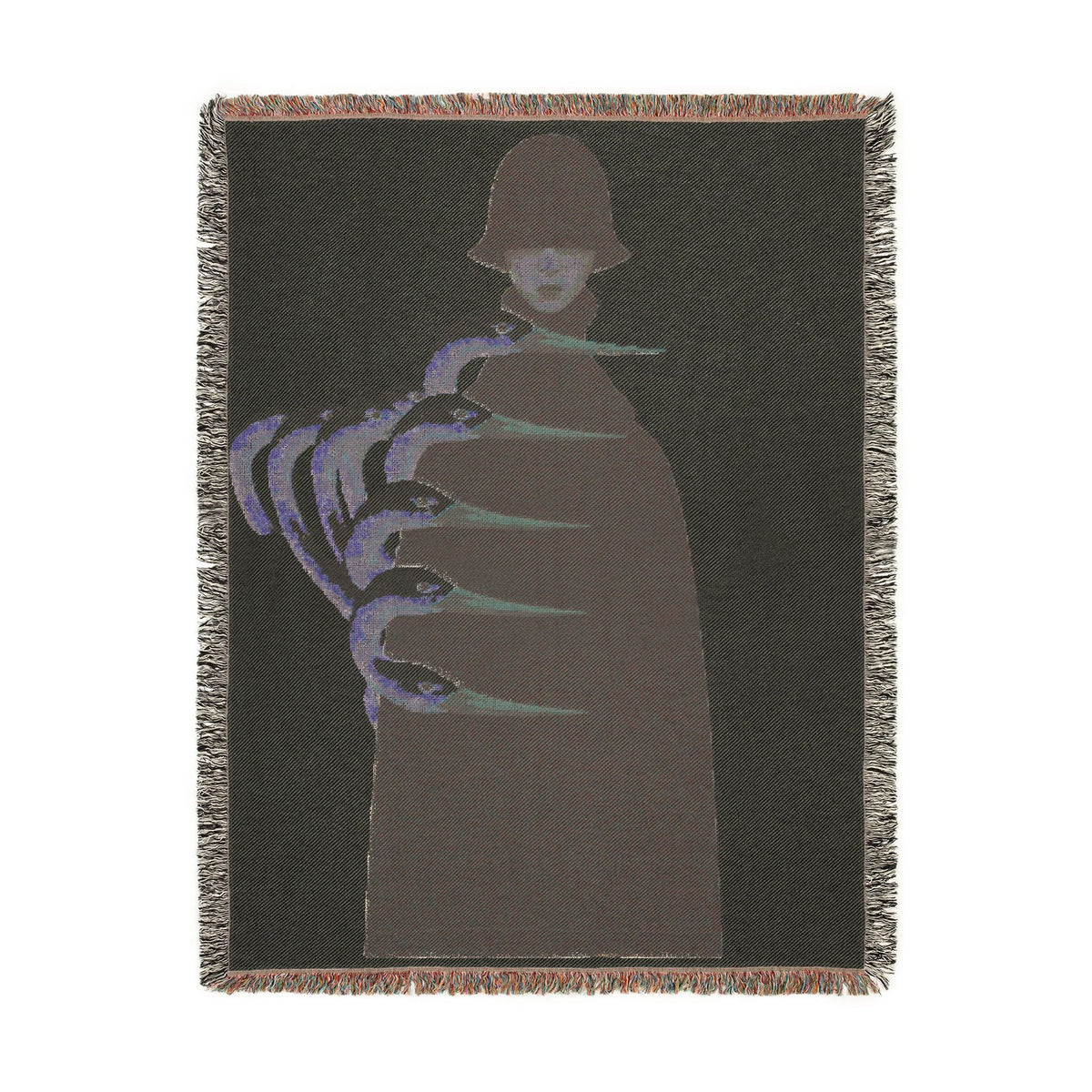 PURETE woven cotton throw blanket featuring a dark silhouette with abstract blue and green claw-like graphic elements.