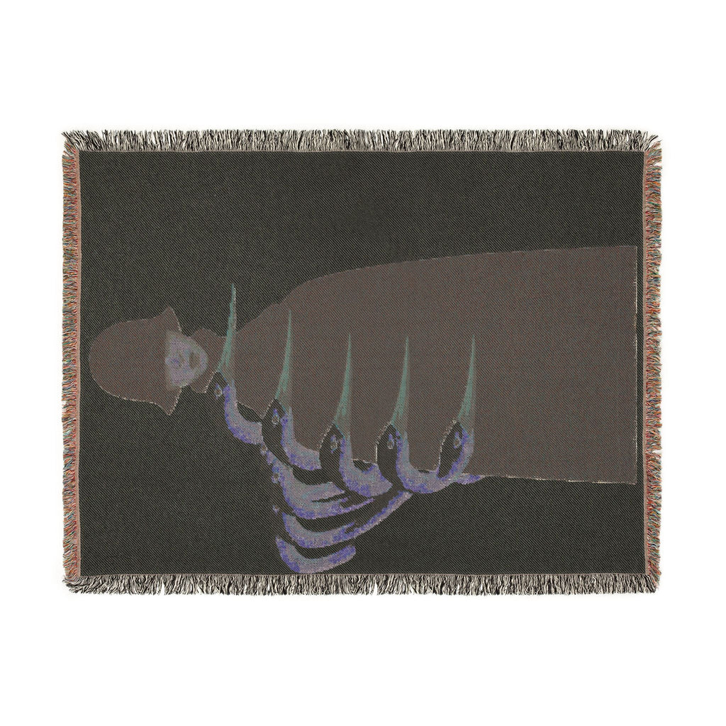 PURETE woven cotton throw blanket featuring a dark artistic graphic with colorful fringed edges.