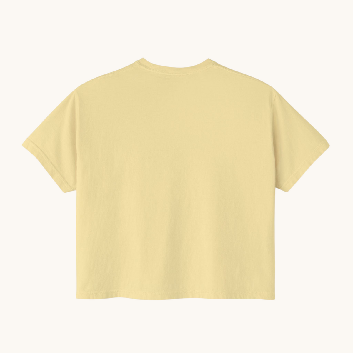 Back view of a PURETE women's oversized boxy t-shirt in a soft yellow pigment-dyed cotton fabric.